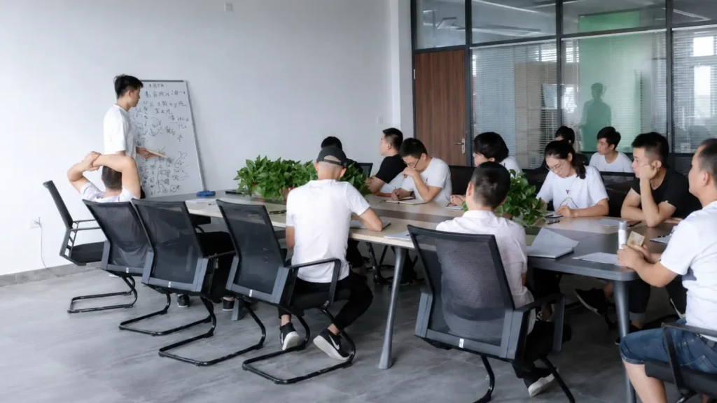 tengwen laser Company team attending a meeting in a modern conference room