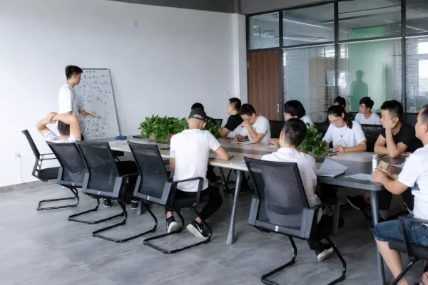 Company team attending a meeting in a modern conference room